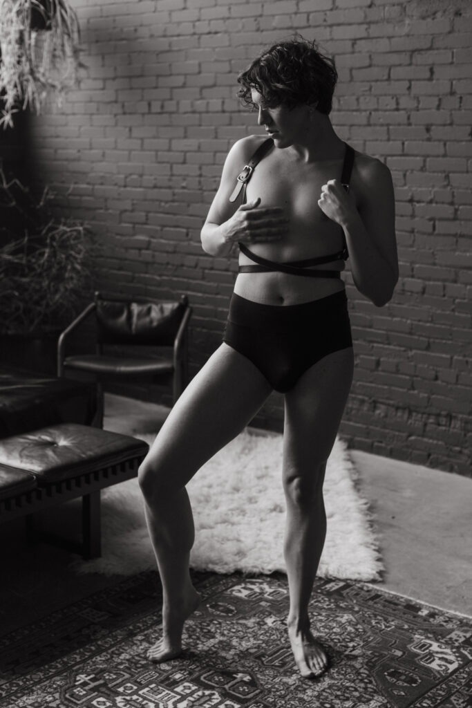 romanesque pose Harrison standing in our studio wearing underwear and our leather harness